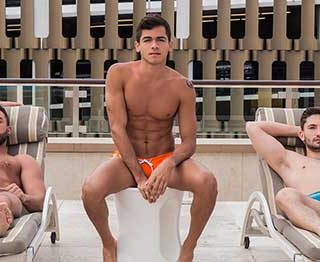 Lounging about in their speedos, real life brothers Preston Cole and Judas Cole lay back and bask in the sun. Along comes newcomer Ashton Summers.